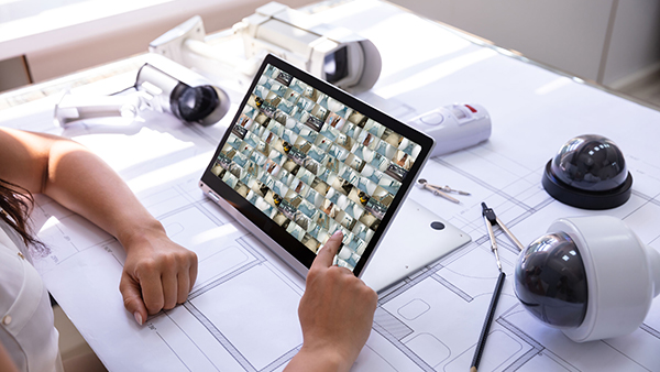Tablet displaying surveillance feeds.